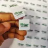 Custom printed hang tag on a flat tea bag with string and tag assembly